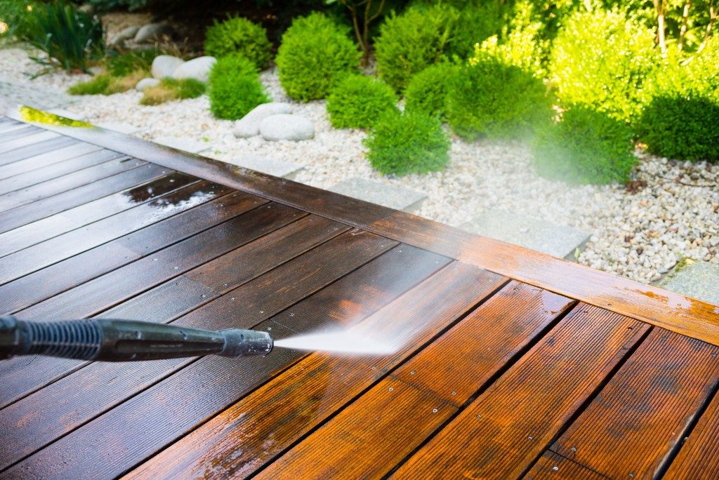 Hose cleaning wooden deck