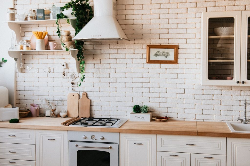 kitchen with brick wall